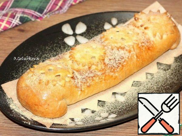 Then grease the cake with beaten egg yolk and bake in a preheated oven to t 190 c until ready.

