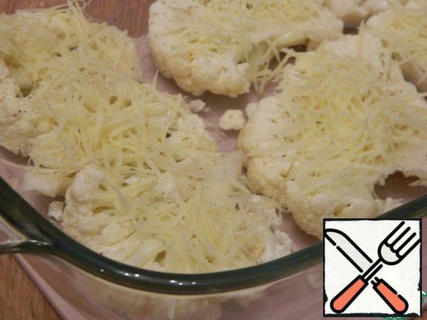 Grate the cheese on a fine grater and sprinkle some of the cheese on the cabbage.