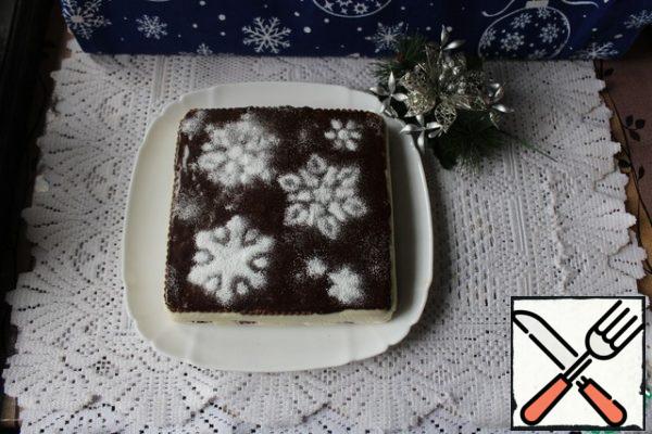 Cover the cookies with a flat surface facing up. Place in the refrigerator for a few hours.
Turn to a plate, remove the film and cover with icing. You can take it ready-made or cook it yourself. Or pour over melted chocolate.
To give a new year's look, I sprinkled powder through a stencil.