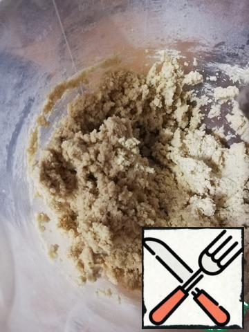 Add to the flour mixture and beat until crumbs form.