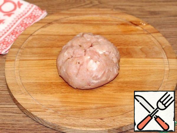 Without breaking the structure of the meat tortilla and filling, we form a large cutlet.