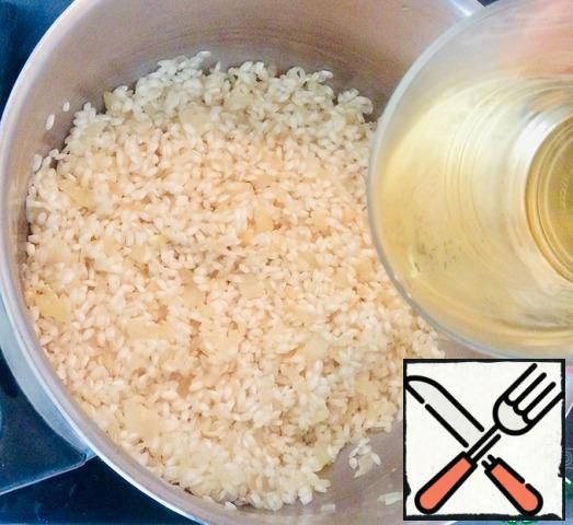 Add the washed rice and stir until the rice is slightly translucent. Add the wine and do not cover until the alcohol has evaporated