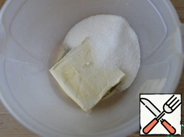 Butter or margarine is taken out in advance, it should be soft. Beat with sugar in a homogeneous cream.