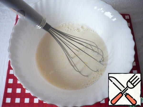 Add warm milk and water. Stir with a whisk.