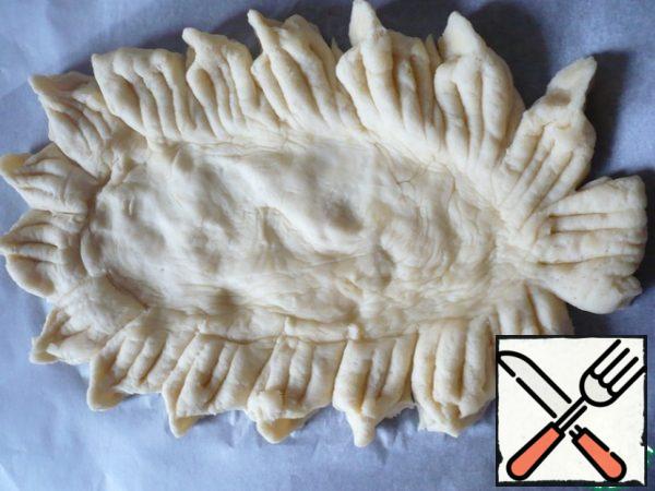 Now make notches on each incision with a knife, and then pinch the incisions with two fingers (as if forming a "twig").