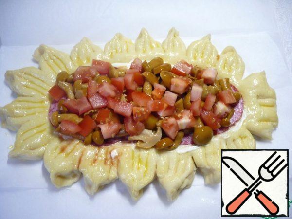 Put a layer of diced tomatoes on the canned mushrooms.