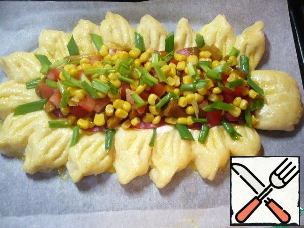Garnish the pizza with finely chopped green onions.