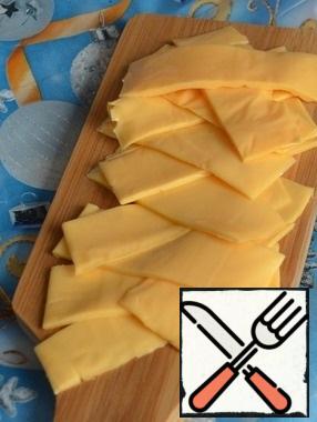 Cut each plate of cheese into 3 pieces.