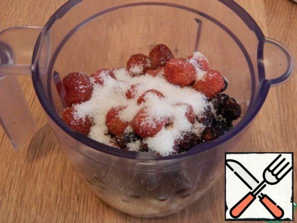 Add strawberries and sugar.