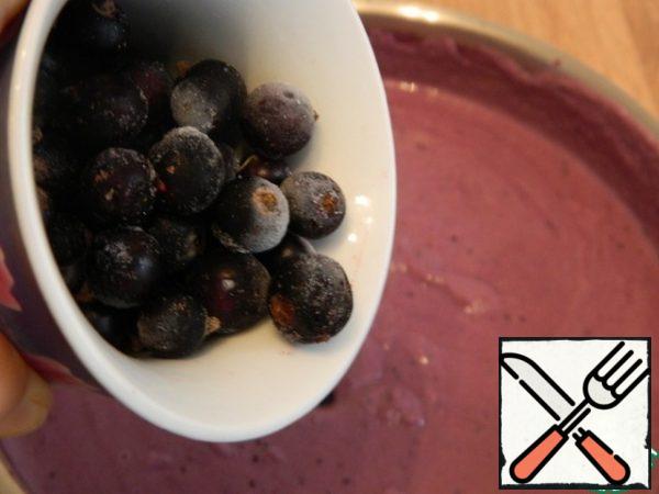 Remove from the heat and add a handful of whole frozen currants to preserve their integrity in the finished cheesecake.
