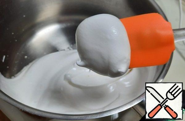 Separate the whites from the yolks. To the yolks, add a little mixture of flour and cocoa (about 2 tablespoons). Stir until smooth. Whisk the whites with sugar and a pinch of salt until stable peaks.