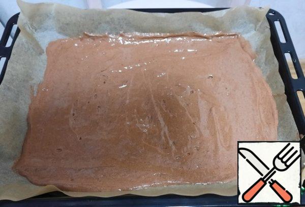 Put the resulting mass on a baking sheet covered with parchment paper (the size of the baking sheet is 30x40 cm). Put in a preheated 180 degree oven for 15 minutes (focus on your oven). The readiness of the cake can be checked with a wooden stick, which should come out of it completely dry.