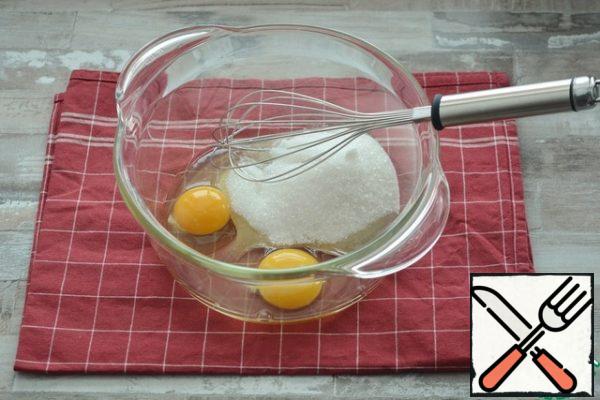 Beat eggs with sugar and a pinch of salt lightly with a whisk until fluffy.