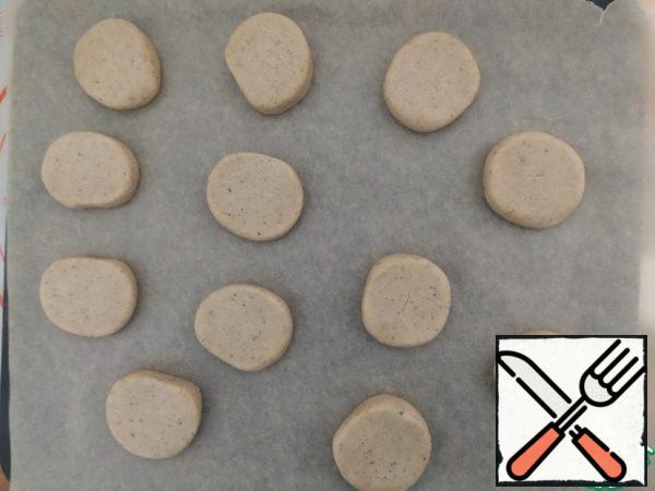 Cut the sausage into 0.5 cm thick circles and place on baking sheets. Bake in a preheated 180 °C oven for 10 minutes, let cool.