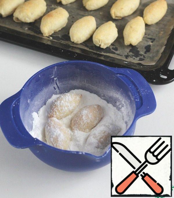 Ready cookies to cool a little and warm roll in powdered sugar.