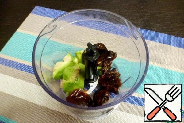 Remove the seeds from the dates and mash the avocado together until pureed.