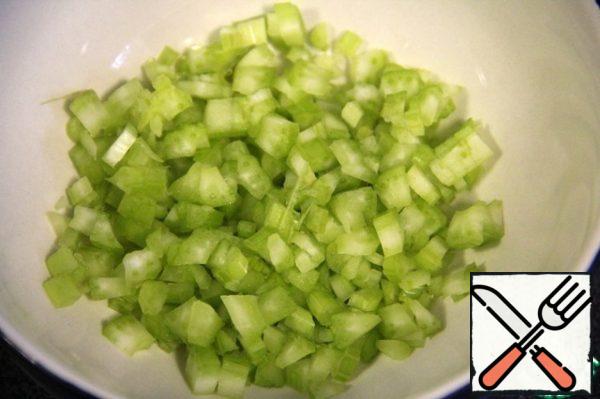 Finely chop the celery.