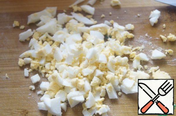 Chop the eggs.