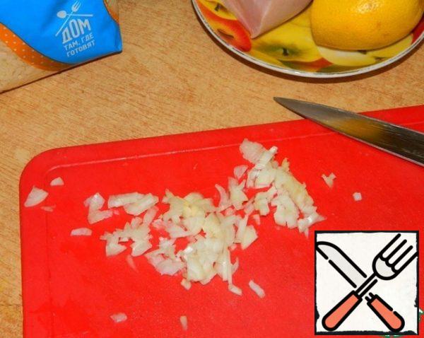 Finely chop a small onion.