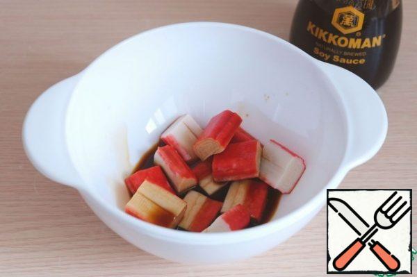 In a bowl, add soy sauce , add diced crab sticks. Leave to marinate for 15-20 minutes.