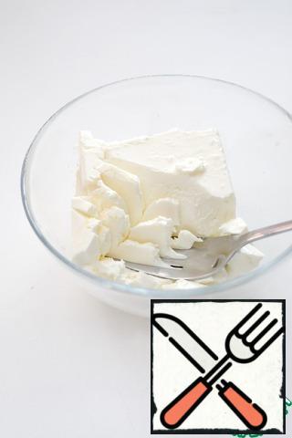 Mash the feta cheese with a fork until smooth. If the cheese is too dense, add a couple of spoons of sour cream