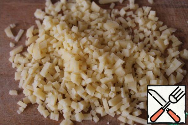 Finely chop the cheese or grate it on a medium grater.