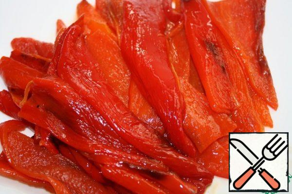 Put the peppers in a tightly closed plastic bag or cover with parchment and leave for 5 minutes. Then peel them. Cut the peeled peppers into wide strips.