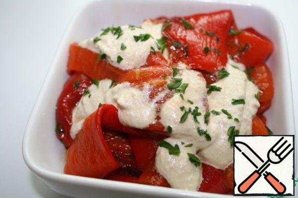 Serve the pepper with a sprinkle of nut sauce and parsley.