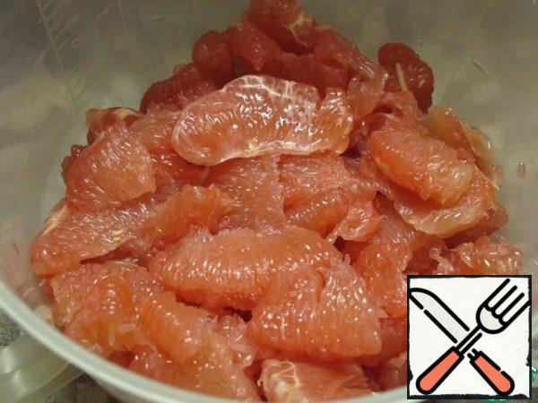 Peel the grapefruit, get rid of the films and seeds.
