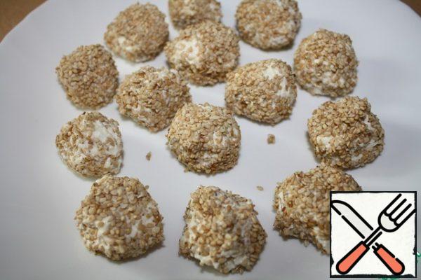 Fry the sesame seeds and roll the cheese balls in it.