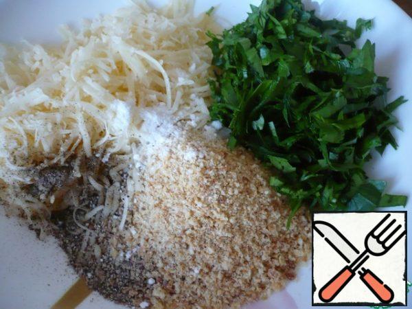 Now prepare the breadcrumbs for eggplants: in a bowl, pour the breadcrumbs, add grated hard cheese, salt, ground black pepper and finely chopped parsley.