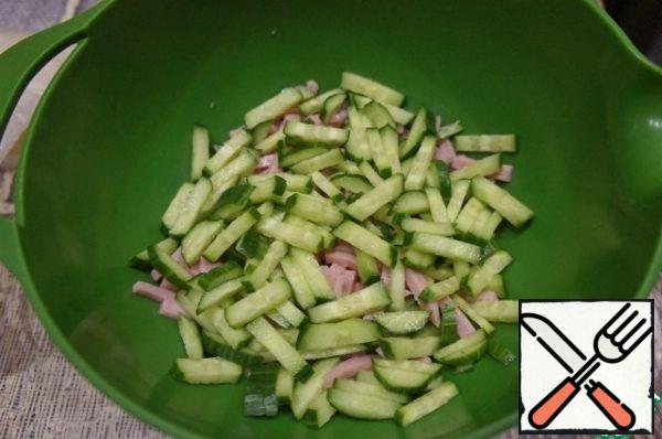 Add the cucumber cut into thick strips.