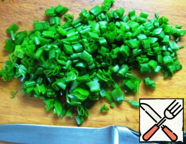 Boil the rice until tender. Cook and peel the eggs.

Chop the green onions.