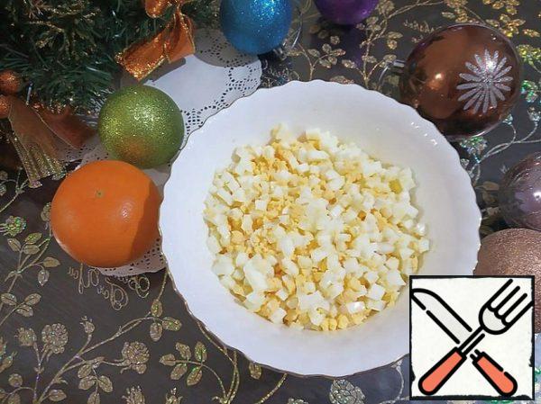 Boiled and chilled eggs are cut into small cubes.