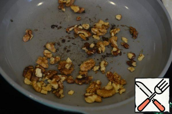 Fry the nuts in a frying pan.
