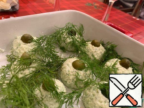 Before serving, garnish the balls with cucumber tails or olive halves and fresh dill.