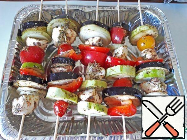Vegetables are strung on skewers, bake over a baking dish in the oven at 180 degrees for about an hour, on the grill - until ready. Serve with your favorite sauce as an independent dish or side dish to meat.