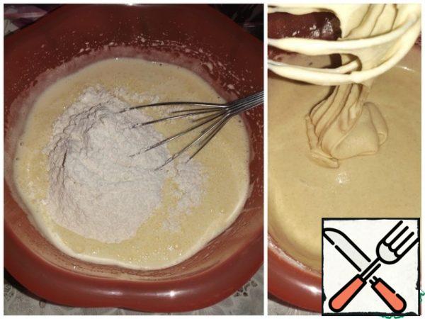 Combine both mixtures: flour and egg. The dough is fragrant and thick, falling from the whisk with ribbons.