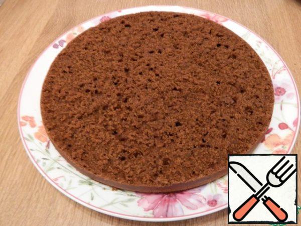 Put the first cake on a plate.