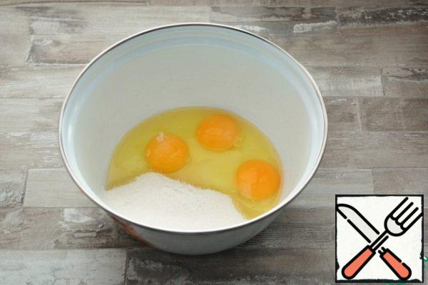 Beat the eggs into a light fluffy mass with salt, sugar and vanilla.