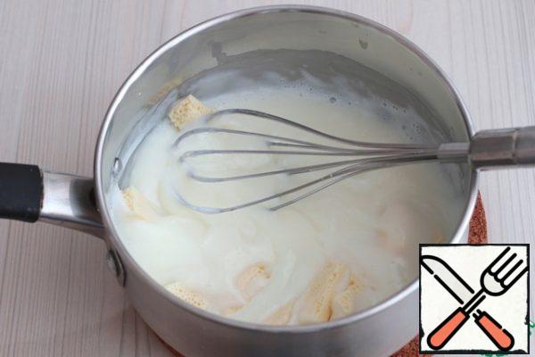 Remove the mixture from heat, add pieces of white chocolate (60 gr.). Dissolve chocolate in hot starch and milk mixture.