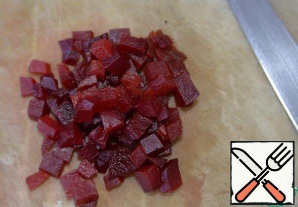 Beets are cleaned, cut into cubes.
