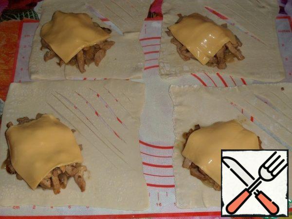 Cover the chicken with melted cheese slices.