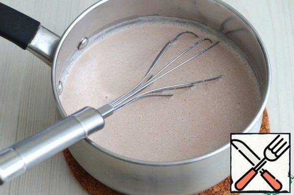 Next, gradually introduce the milk-pudding base into the hot milk and, with constant stirring, boil the mixture until thickened.