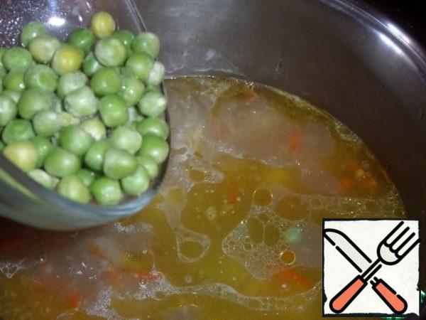
Add green peas to the pan.