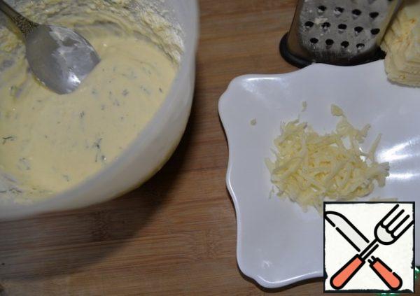 Cheese three on a grater, put in the dough. Mix it up.