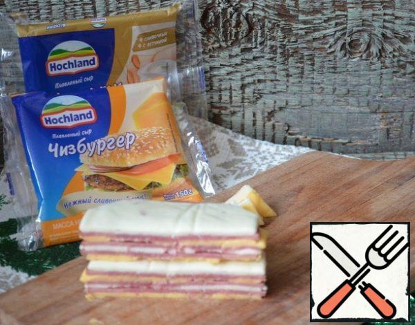 Fold the cheese and ham into a pile, trim and cut into 4 pieces.