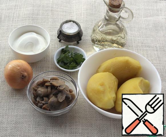 Boiled potatoes in a uniform, canned mushrooms, sour cream, onions, these are the main ingredients from which you can prepare a delicious lunch or dinner.