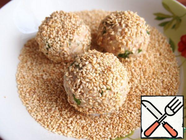 Roll the balls in sesame seeds.