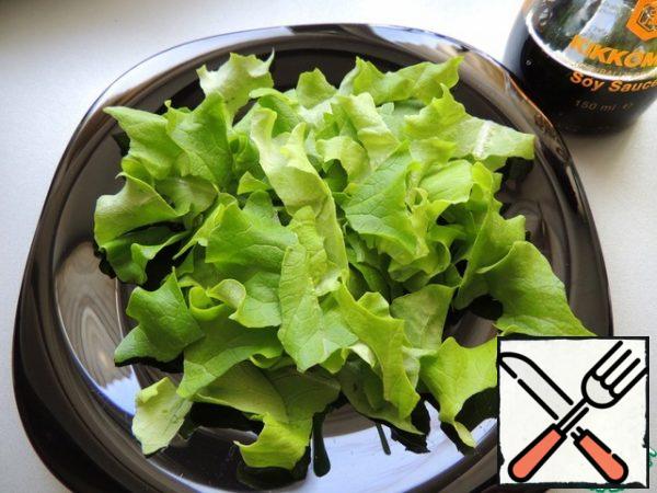 Lettuce leaves are torn by hand.